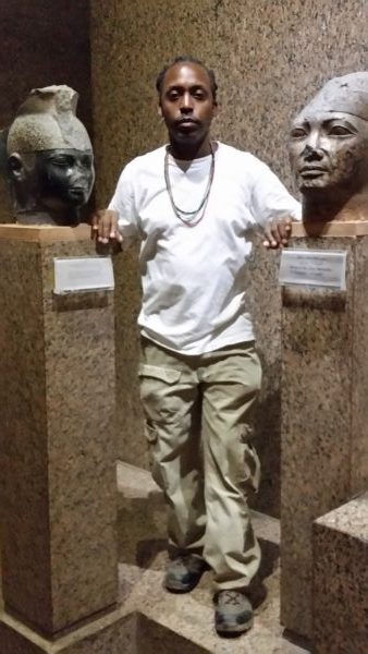 Standing between the busts of Taharka, left, and Shabaka, right. 25th Dynasty - Nubian Museum